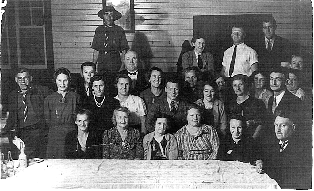 Kurri Group Committee 1940. Sen Cons C.S. Dimmock group president, sitting at the end of the table with Charles Triggs Standing next to him and Bess Triggs sitting 1st from the left